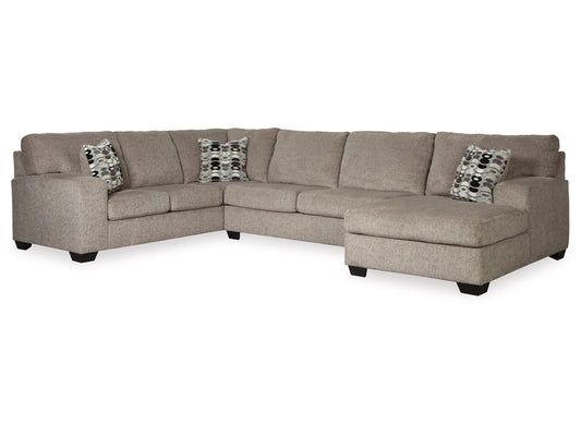 Introducing the Ballinasloe 3-Piece Sectional with Chaise, a beige L-shaped sofa featuring five cushions and a right-side chaise. This sectional includes two eye-catching accent pillows in black, gray, and white patterns. With its wide armrests and block feet, it offers a sleek modern aesthetic.