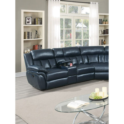 A living room is highlighted by the expansive Luxurious Manual Motion Sectional Sofa in blue leather, along with a glass coffee table adorned with candles and decorative elements. The space features beige walls equipped with built-in shelves filled with books and decor, as well as large windows draped in sheer curtains. Light wood flooring completes the elegant atmosphere.