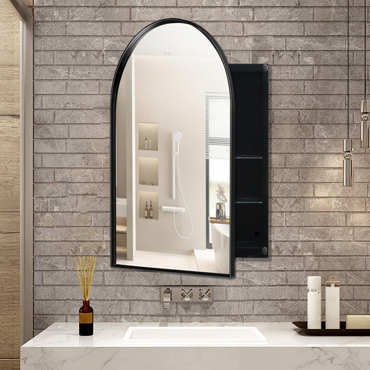 A modern bathroom features a brick wall with an Arched Recessed Medicine Cabinet that includes a mirrored front and adjustable shelves. Below is a white marble countertop with a rectangular sink. On the counter, there's a reed diffuser and soap dispenser, while pendant lights hang on the right.