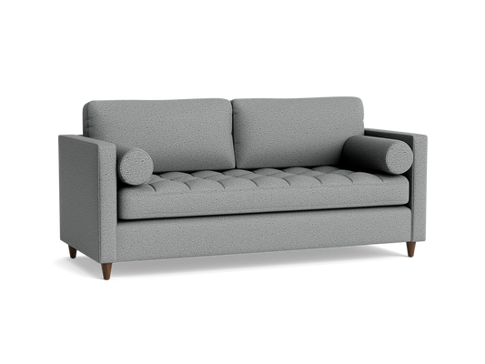 The Briar Sleeper Sofa, a contemporary gray fabric piece featuring two back cushions, two bolster pillows, and wooden legs against a black background, showcases a textured, tufted seat design.