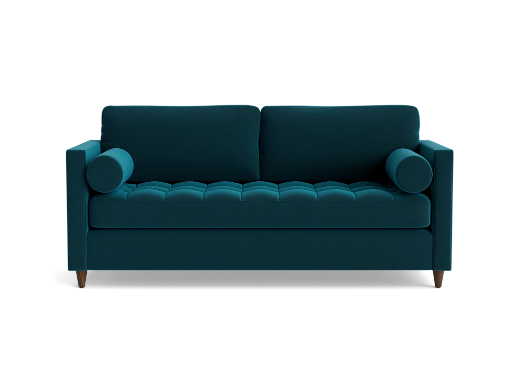 The Briar Sleeper Sofa is showcased against a plain black background, featuring button-tufted cushions and cylindrical armrests in a dark teal color. It boasts wooden legs and a modern design.