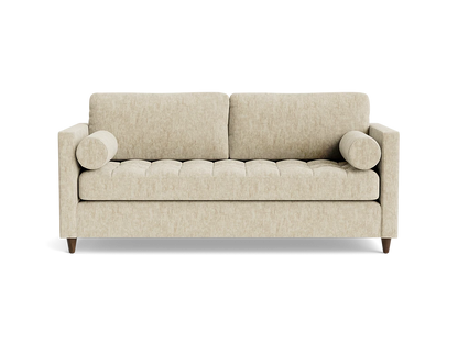 The Briar Sleeper Sofa, featuring a beige finish with a tufted seat, two rectangular back cushions, and cylindrical bolster pillows on either side, is set against a black background.