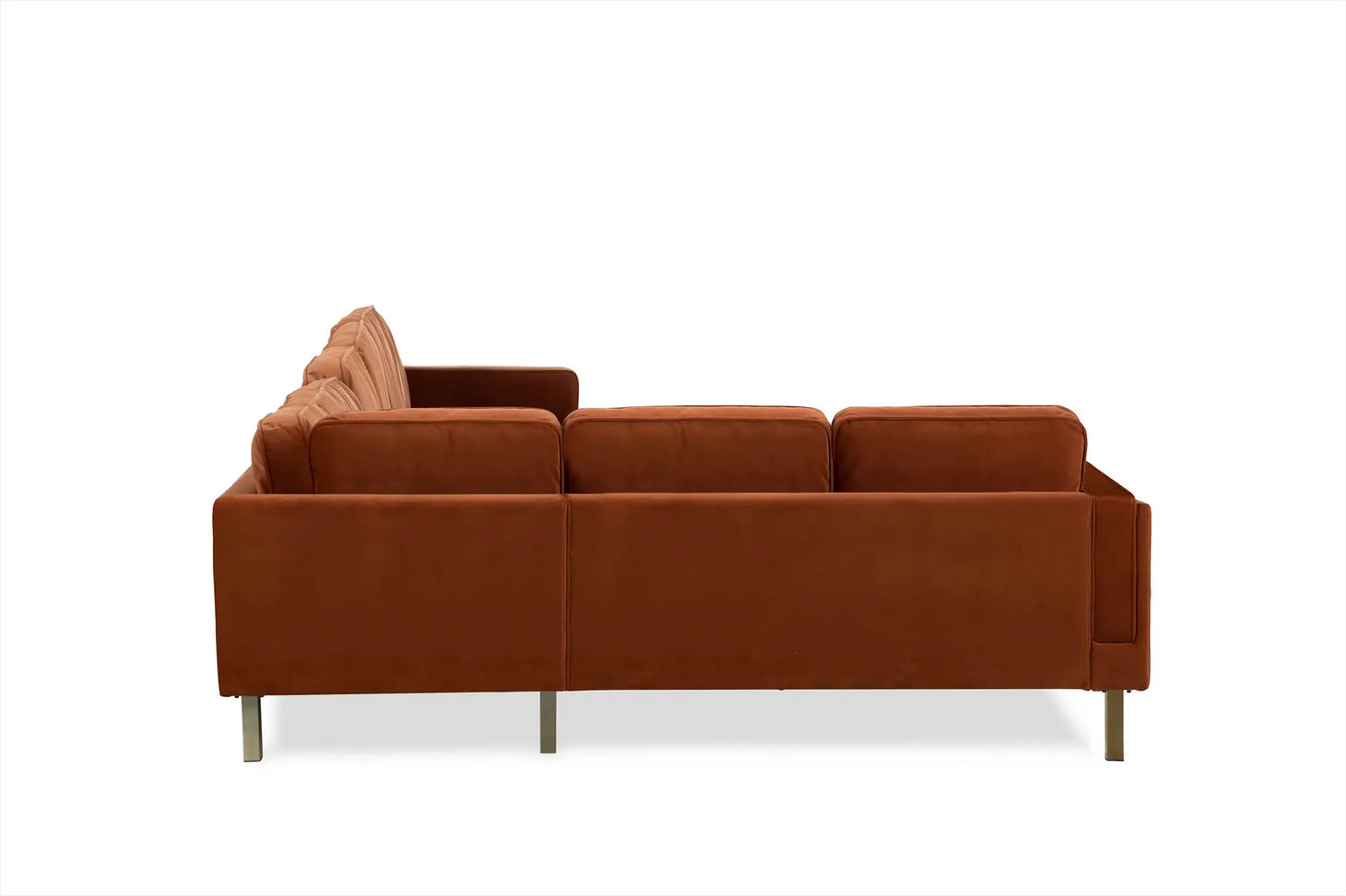 Side view of the Albany Corner Sectional in rust velvet, featuring a modern design with straight lines, metallic legs, and plush cushions. The fabric's soft, velvety texture is accentuated against a white background, highlighting its contemporary style.