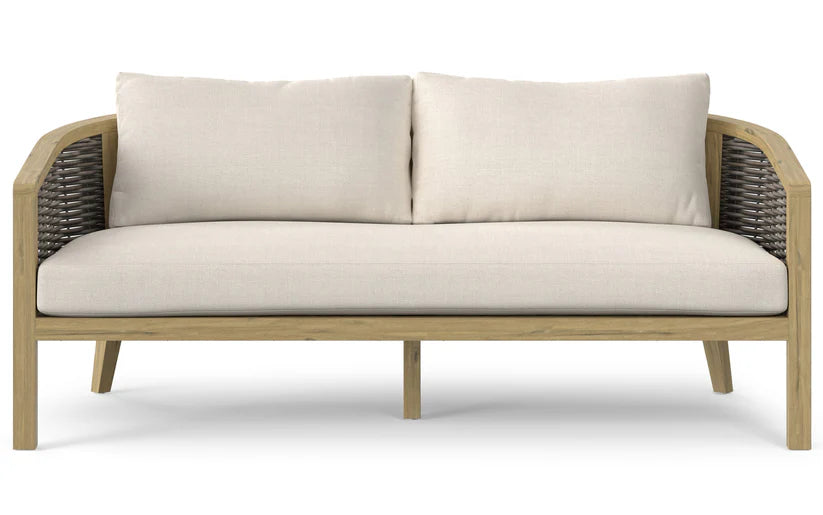 Introducing the Parkside Outdoor Sofa: a chic loveseat featuring a wooden frame, two beige cushions, and woven armrests, meticulously designed for both comfort and elegance. Its simple yet modern aesthetic makes it an ideal fit for diverse interior styles.