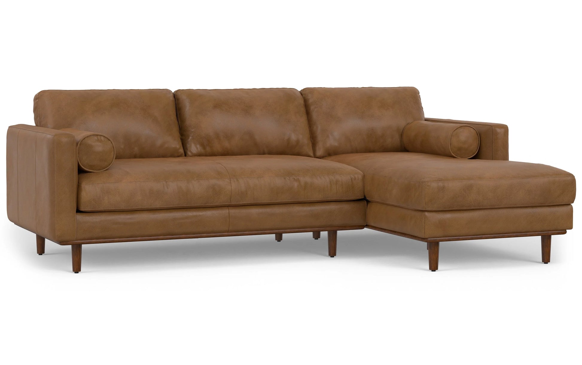 Introducing the Morrison Mid Century Sectional in Genuine Leather: a brown leather sectional sofa equipped with a right-hand chaise lounge. It includes three seat cushions, three back cushions, two cylindrical bolster pillows, and is supported by wooden legs.