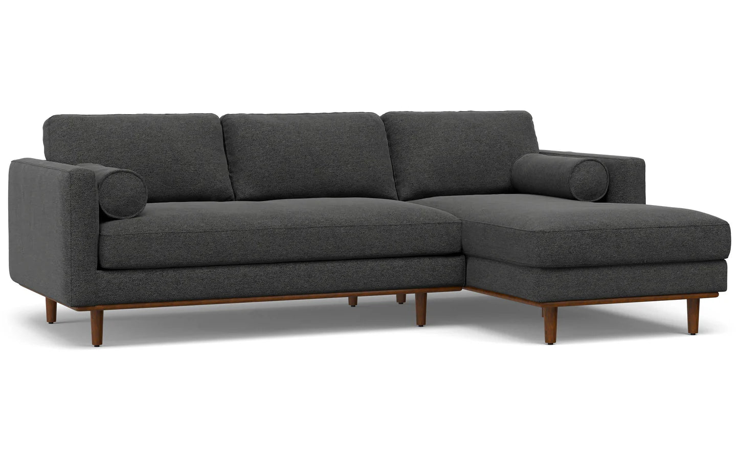 Introducing the Morrison Mid Century Sectional in Genuine Leather: a sophisticated dark gray L-shaped sofa featuring elegant wooden legs. This stylish piece includes three plush back cushions and round armrest pillows, complete with a right-side chaise for ultimate lounging comfort.