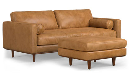 Introducing the Morrison 89-Inch Sofa and Ottoman Set in Genuine Leather, featuring a brown leather sofa that comes with square arms and two rounded pillows. Both the sofa and the coordinating ottoman rest on elegant wooden legs, with the ottoman perfectly placed in front of the sofa for a cohesive look.