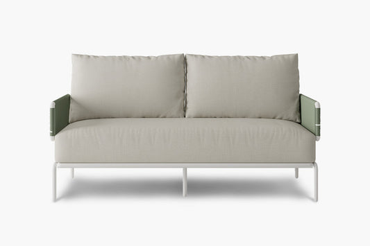 Introducing the Sylva Outdoor Modular Sofa by Acanva, a contemporary piece with a minimalist aesthetic. It features light gray fabric upholstery complemented by green side panels. The sofa is equipped with two generous cushions and rests on a sleek white metal frame.