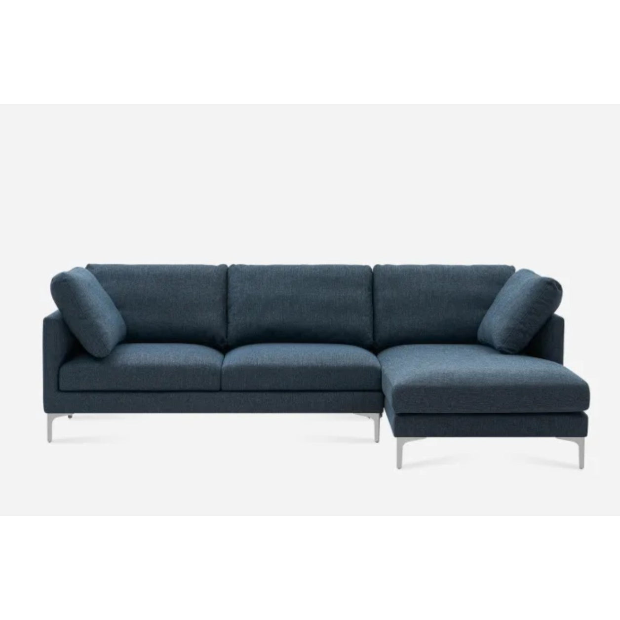 A modern dark gray sectional sofa with a minimalist design. It features a right-side chaise lounge and slim metal legs, providing a sleek look against a plain white background.