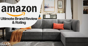 A modern living room features a gray sectional sofa with an orange throw blanket and orange cushions. On the wall, there are cabinets and framed artwork. A banner reads "Amazon Ultimate Brand Review & Rating." The "couch" logo is in the bottom left corner.