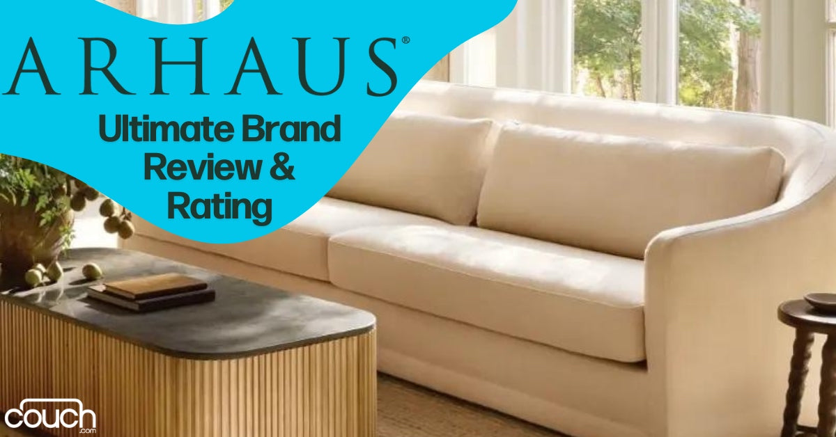 A cozy living room scene with a modern beige sofa, a wooden coffee table with plants and books, and large windows with natural light. The text reads "ARHAUS: Ultimate Brand Review & Rating" and displays the Couch website logo.