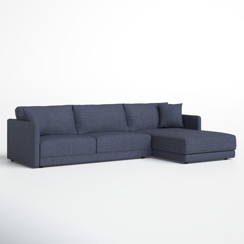 The Astra 2-Piece Upholstered Sectional is a modern sectional sofa in dark gray, featuring clean lines and a right-side chaise lounge. It offers thick cushions with a simple, minimalist design, all set against a plain white background.