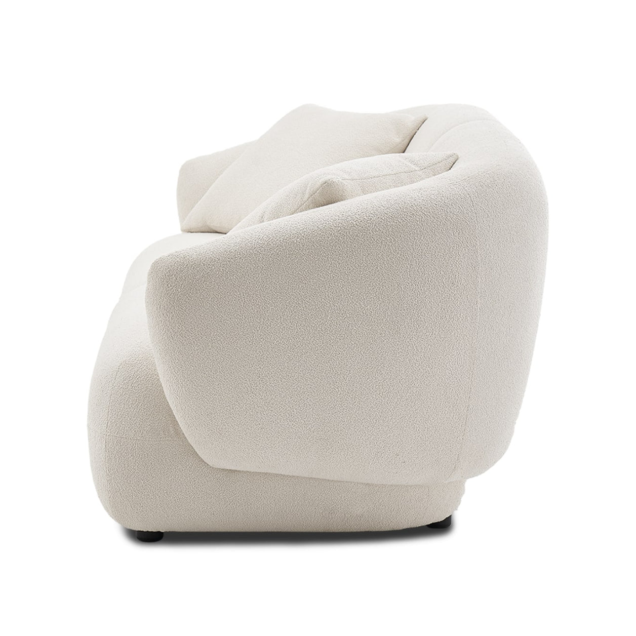 A rear view of the Auburn Performance Fabric Sofa, featuring a modern design in light beige with rounded edges, set against a plain white background. The sofa has a smooth, minimalist style with a split down the middle.