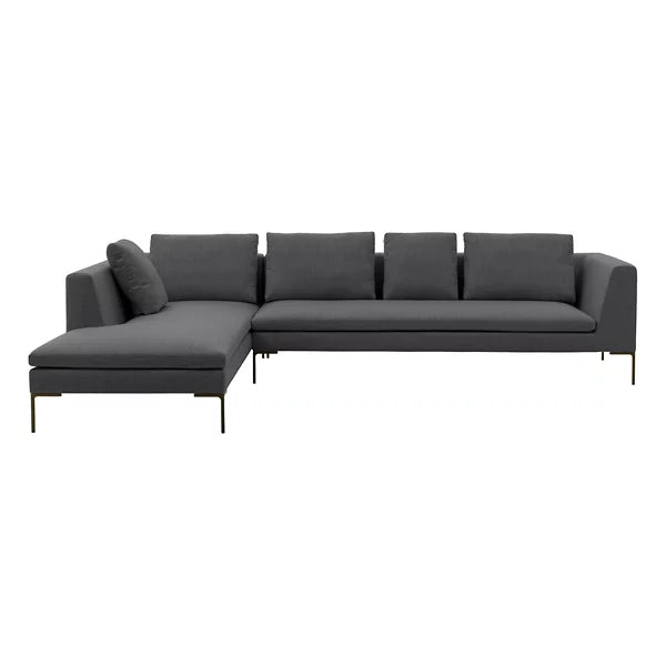 The Charles Left Arm Sectional Sofa by B&B Italia is a contemporary L-shaped sectional in dark gray fabric, featuring five back cushions and an additional side cushion. It boasts sleek metal legs and includes a left-side chaise for generous seating space.