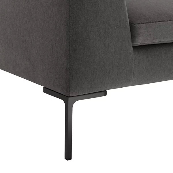 Close-up of the Charles Left Arm Sectional Sofa by B&B Italia, featuring a modern dark grey fabric with sleek black metal legs against a white background, highlighting its minimalist design and smooth upholstery.