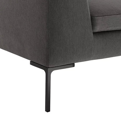 Close-up of the Charles Left Arm Sectional Sofa by B&B Italia, featuring a modern dark grey fabric with sleek black metal legs against a white background, highlighting its minimalist design and smooth upholstery.