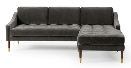 Introducing the Brando 83" Leather Sofa Right-Facing Sectional, a contemporary masterpiece that embodies modern sophistication. Finished in dark gray leather with tufted cushions and wooden legs adorned with gold accents, this sectional features a right-facing chaise, forming an elegant L-shape that perfectly complements any stylish living room.