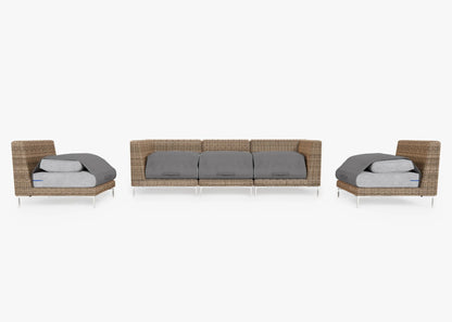 A contemporary outdoor furniture arrangement, the Brown Wicker Outdoor Sofa with Armless Chairs - Five Seat showcases an elegant three-seater sofa and two matching armless chairs. Each piece features woven rattan-style frames complemented by thin white metal legs, all set against a plain white background.