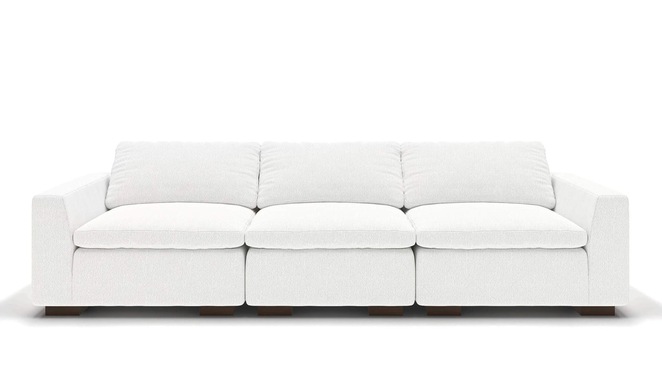 A sleek, minimalist 106" Like Butter sofa in luxurious Enzo/Cream leather, featuring plush cushions and blocky wooden legs, set against a plain white background.