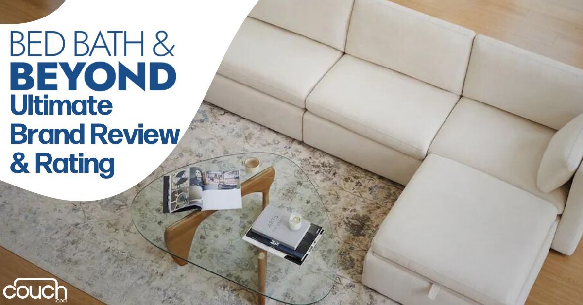 Top view of a white sectional sofa with a light-colored rug and a glass coffee table. The table holds a magazine, a book, and a small bowl. Text reads: "BED BATH & BEYOND Ultimate Brand Review & Rating." The couch.com logo is in the bottom left corner.