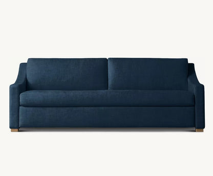 Presenting the Belgian Classic Slope Arm Premium Sleeper Sofa, this dark blue piece boasts a contemporary style with clean lines and a minimalist design. It features wide, cushioned armrests and wooden legs for a sleek and modern appearance. The sofa is showcased against a plain white background.