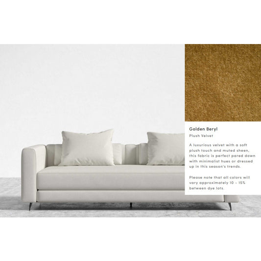 A Berlin Sleeper Sofa in white velvet with large cushions is showcased against a minimalistic backdrop. To the right, a close-up swatch of golden beryl plush velvet fabric is presented, accompanied by descriptive text highlighting its luxurious texture and dye lot variations.