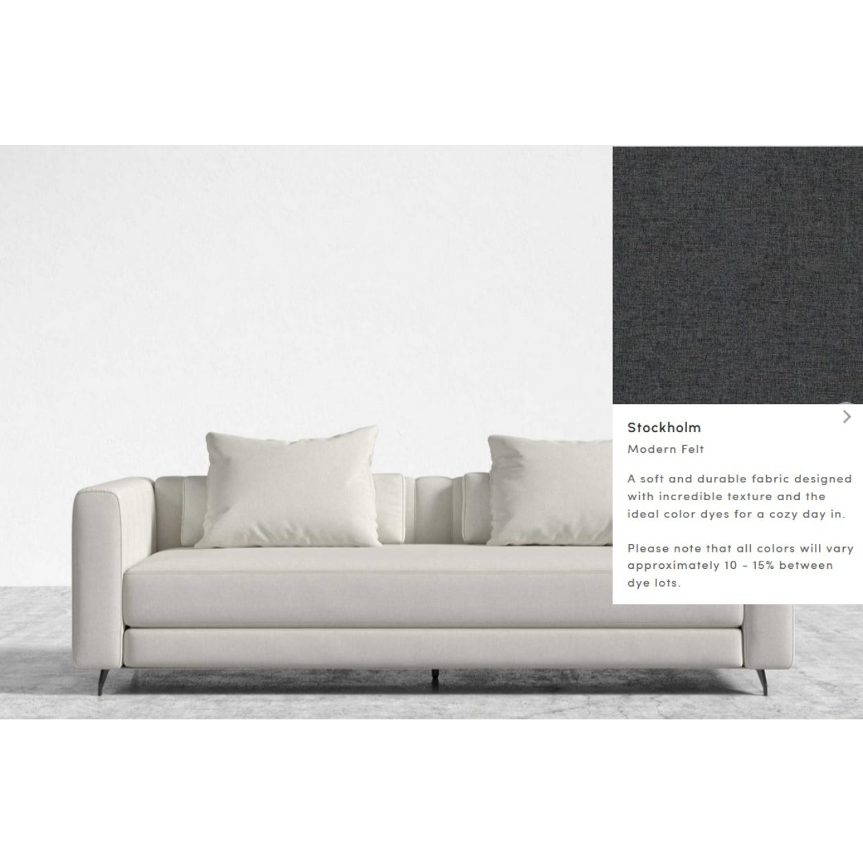 The Berlin Sleeper Sofa is a contemporary piece in a light shade, featuring two large and two smaller cushions. It is upholstered in the "Stockholm Modern Felt" fabric, renowned for its soft and durable qualities. The accompanying image displays a fabric sample with a dark, textured appearance.