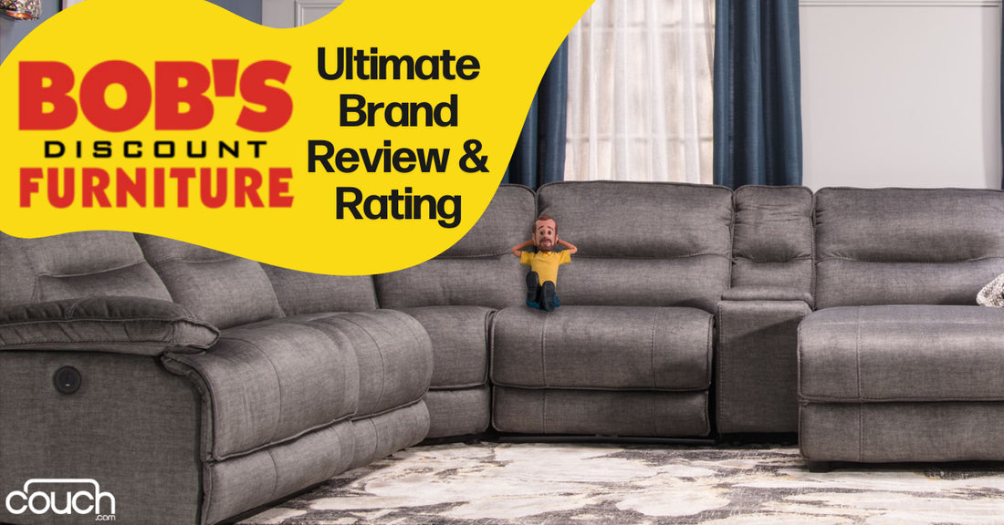 Gray sectional sofa in a living room with a plush rug. A man figurine is placed on the couch. The text reads "Bob's Discount Furniture" and "Ultimate Brand Review & Rating.