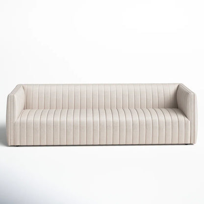 The Brandt 97'' Upholstered Sofa features a modern cream color, vertical channel tufting, and square armrests, all presented against a plain white background.