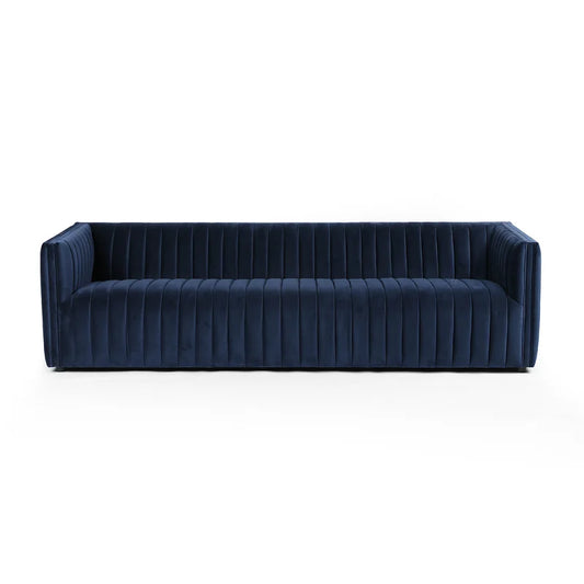 The Brandt 97'' Upholstered Sofa features a contemporary design with deep seats and a low-profile back, upholstered in rich, dark blue velvet. Its vertically tufted fabric adds a touch of luxury and sophistication. The sofa is equipped with wide armrests and showcases a sleek, minimalist aesthetic against a plain white background.