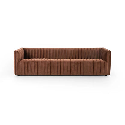 The Brandt 97'' Upholstered Sofa, featuring a brown velvet finish with vertical tufted stitching and square arms, is set against a white background. This sofa boasts a modern, streamlined design, offering both comfort and style.