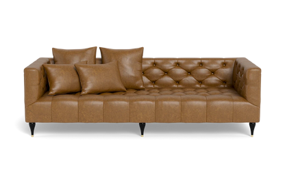 Ms. Chesterfield Leather Custom Sofa in brown leather, accompanied by four matching cushions. The design showcases a tufted back and seat with dark wooden legs, offering a classic and elegant appearance.