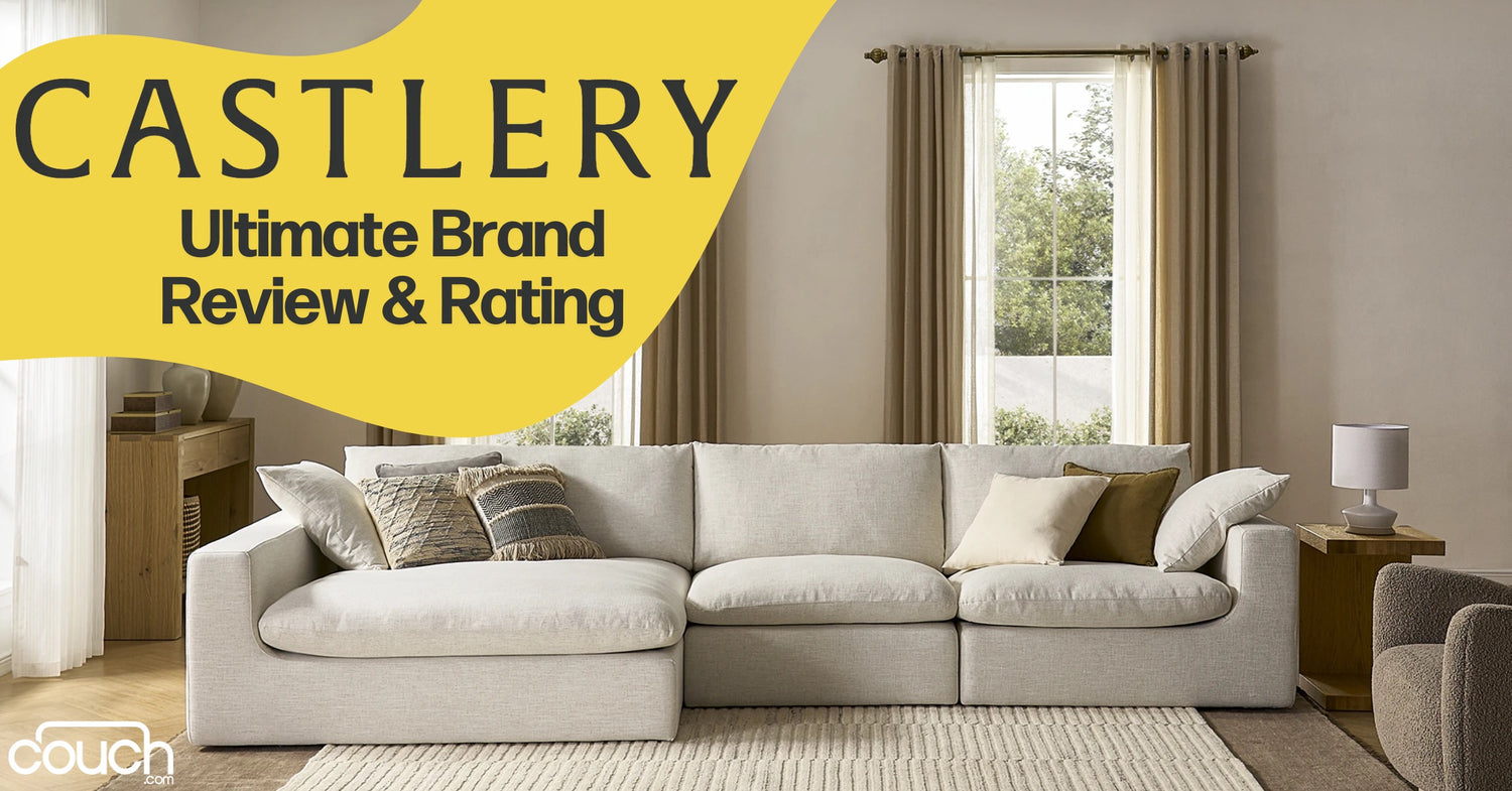 A spacious living room features a large, light-colored sectional sofa with various patterned cushions. A wooden side table with a lamp is on the right. Sunlight streams in through a window with beige curtains. Text overlay reads, "CASTLERY Ultimate Brand Review & Rating.