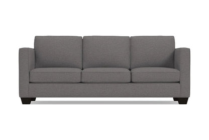 The Catalina Sofa is a stylish grey three-seater featuring square arms and dark wooden legs, all displayed against a plain white background. Its clean lines and modern design make it a chic addition to any space.