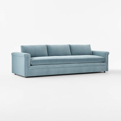 Ceva 103" light blue performance velvet sofa with a modern, streamlined design, featuring three seat cushions and three back pillows. Displayed against a plain white background.