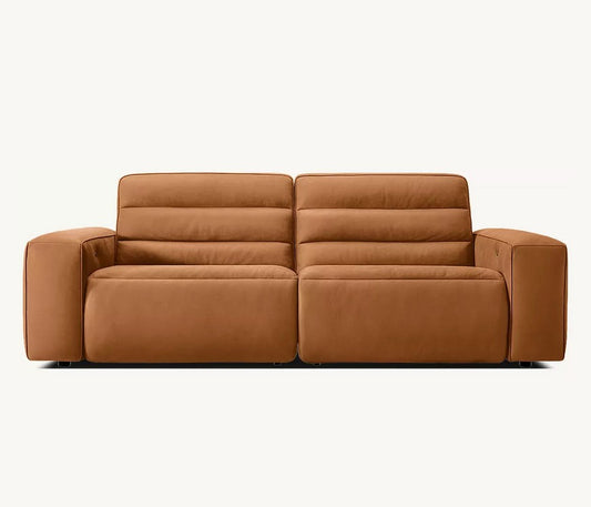 The Chelsea Motion Leather Modular 2-Piece Recliner Sofa is a contemporary, brown leather sofa featuring wide armrests and a minimalist aesthetic. The seat cushions and backrests are adorned with subtle horizontal tufting, offering a sophisticated and inviting look.