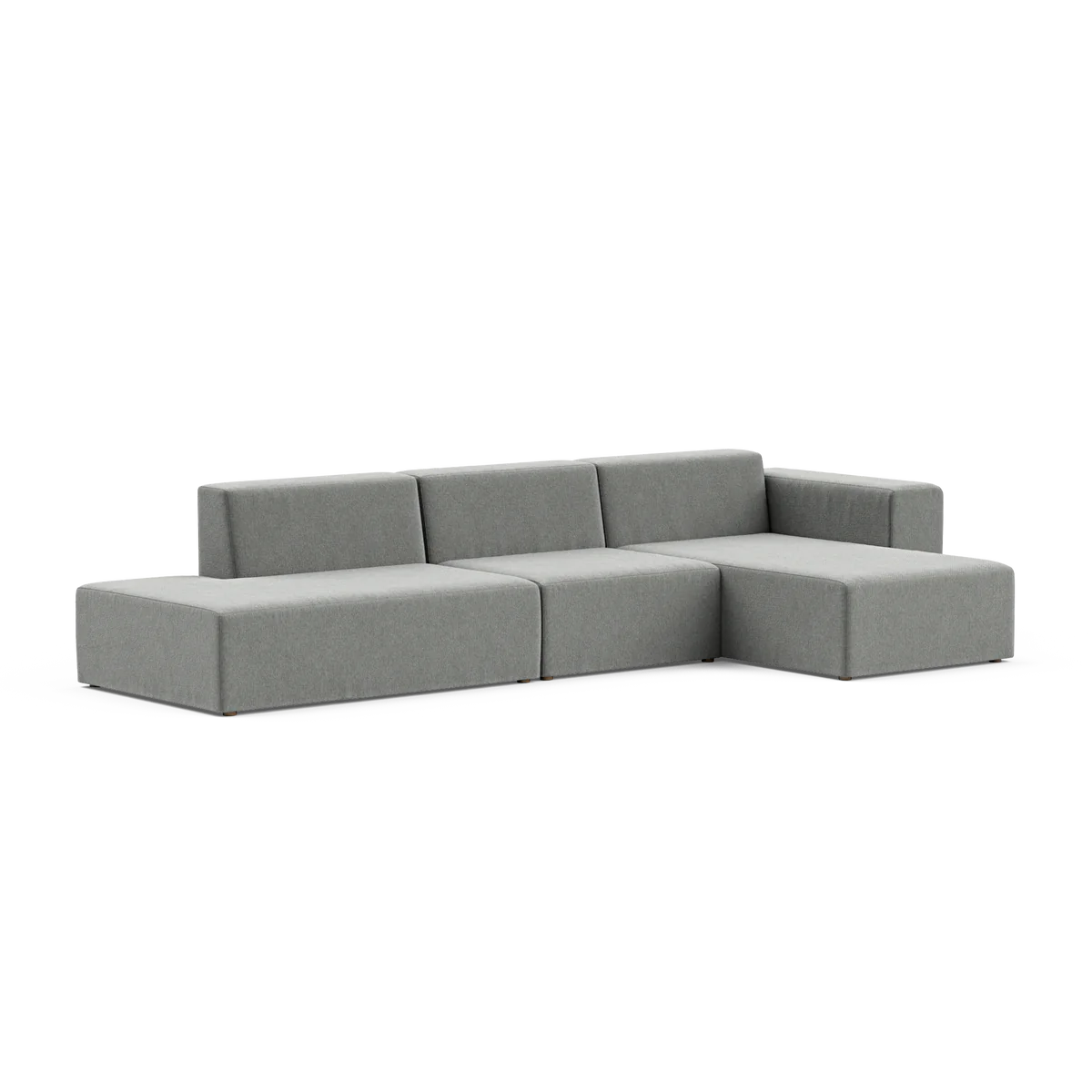 The Three-Seater Form Sectional is a minimalist gray L-shaped sofa featuring clean lines and a low-profile design. Set against a plain white background, it highlights its sleek and modern appearance.