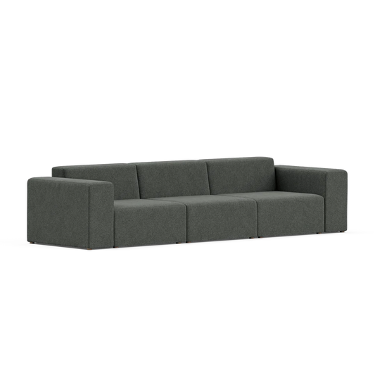 The Three-Seater Form Sectional features a modern, modular design with three separate sections and square armrests, set against a neutral background. Its minimalist and sleek appearance is complemented by a plush fabric finish.