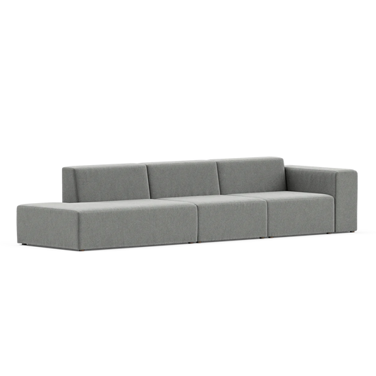 The Three-Seater Form Sectional is a modern and minimalist gray sofa featuring three seat sections and a low backrest, designed with clean lines and a boxy shape. It sits on a flat surface in a well-lit environment.