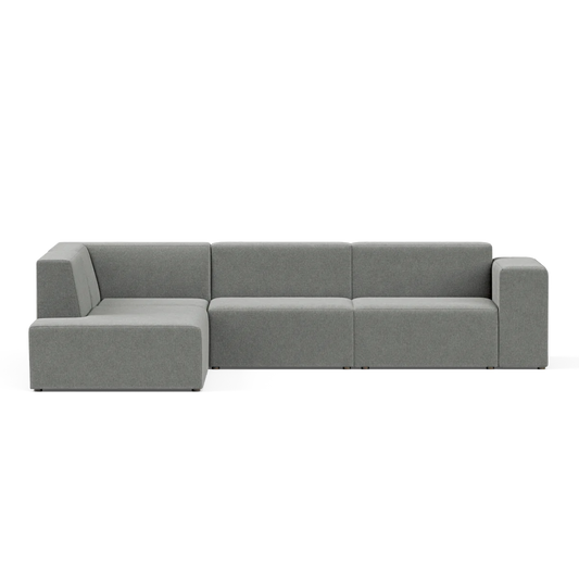 The Four-Seater Form Sectional is a contemporary, modular gray sofa displayed on a plain background, consisting of three sections with sleek, straight lines and a minimalist design.