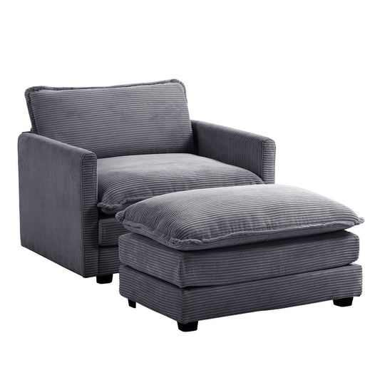 Introducing the Jearey Corduroy Sectional Sofa in a sophisticated gray hue, complete with a matching ottoman. This chair boasts a boxy silhouette and plush cushions, providing both comfort and a modern aesthetic. The coordinating ottoman sits directly in front, offering an inviting place to relax.