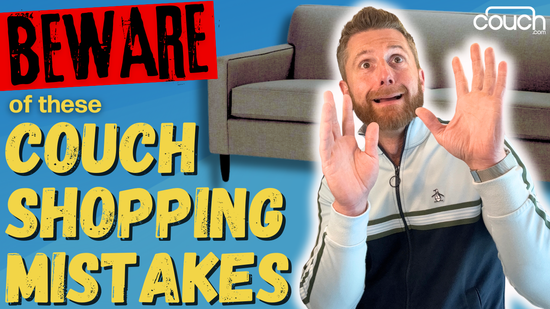 A man with a surprised expression holds up his hands in a warning gesture. A couch is in the background. The text reads: "BEWARE of these Couch Shopping Mistakes". The logo "couch.com" is at the top right corner.