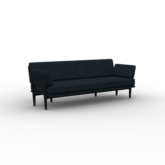 The Sofa 2.0, a contemporary upholstered piece in dark blue, showcases a minimalist aesthetic with its clean lines and rectangular cushions, all set against a plain white background.