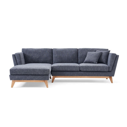 The ValMinimal Sectional is a contemporary dark gray L-shaped sofa featuring wooden legs and comes with a matching throw pillow on one side.