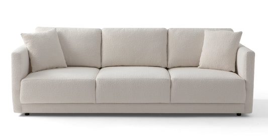 A contemporary Domus 93" Leather Sofa in white with a textured fabric finish, showcasing three seat cushions and two matching throw pillows, set against a plain background.