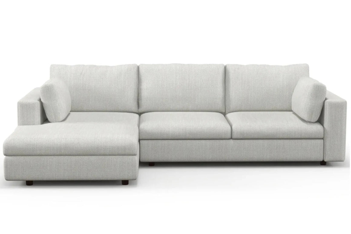 Introducing the Daphne Chaise 96" Sofa, an elegant light gray L-shaped sectional that boasts a chaise on the left. This modern and minimalist sofa includes three seat cushions, complemented by two matching back cushions and two additional smaller side cushions for added comfort.