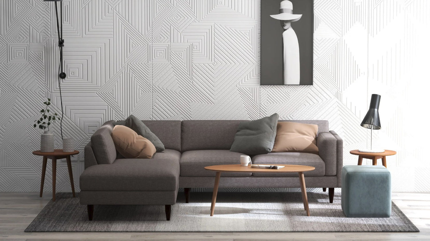 Grey sectional sofa in a room with three wooden tables, a teal ottoman, and an abstractly geometric wall. 