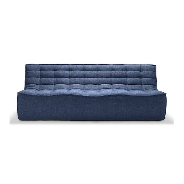 The N701 3 Seater Sofa by Ethnicraft is a contemporary, blue piece featuring a quilted design with a rectangular shape, offering a straightforward, minimalist aesthetic. It boasts a smooth, wave-like seat and a tall back adorned with stitched squares. The sofa is supported by an invisible, low-profile base.