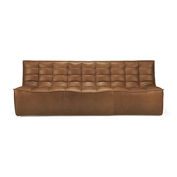 N701 3 Seater Sofa by Ethnicraft made of brown leather with a tufted design, showcasing a modern and sleek look. It features a low back and wide seat, displayed on a plain white background.