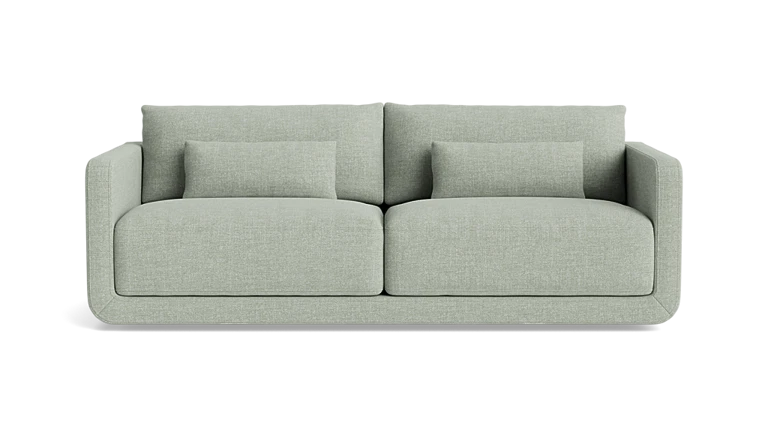 Introducing the Eva 85" Sofa, a modern piece in a light gray hue featuring two spacious seat cushions and two large back cushions. It comes with two smaller matching pillows, showcasing clean lines and a minimalist design against a plain black background.